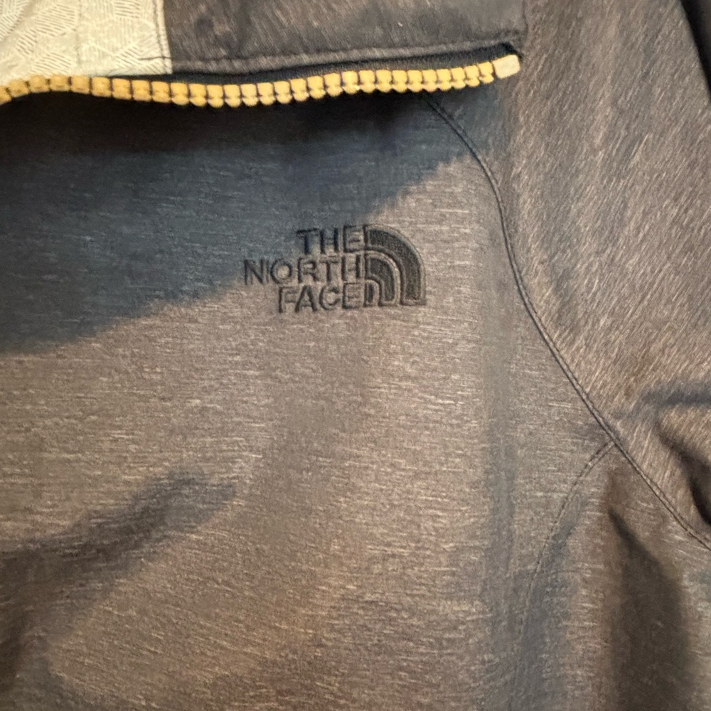 The North Face Charcoal Gray Rain Parka with gold zipper. - Picture 3 of 8